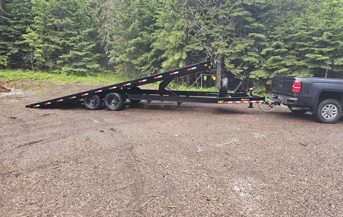 Big Tex tilt deck trailer hitched to a pickup truck